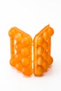 Picture of Open Empty Obsolete Orange Egg Hiolder. Placed Against White Background