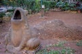 Stock photo of a old dirty open mouthed frog dustbin kept in the public park or garden. Picture captured under natural light at  K Royalty Free Stock Photo