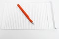 Picture of open notepad with orange pen Royalty Free Stock Photo