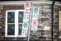 Typical North American no parking signs with detailed instructions on the parking regulations taken in Toronto, Ontario, Canada Royalty Free Stock Photo