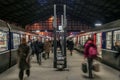 Passengers rushing near a suburban train on a platform of Gare Saint Lazare train station. Royalty Free Stock Photo