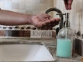 Picture of a person washing hands with soap