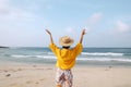 picture of person waving hands out in the air on the beach generative AI