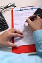Picture of phone and hand with pen on the form. Portrait of calculator, glasses and clipboard Royalty Free Stock Photo