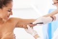 Plastic surgeon making marks on patient`s body Royalty Free Stock Photo