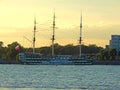A black and white three-masted ship moored on the Neva river in Saint Petersburg, Russia