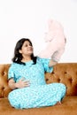 Picture of pregnant lady is holding teddy bear in hand with smile face Royalty Free Stock Photo