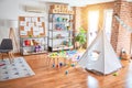 Picture of preschool playroom with colorful furniture, and toys around empty kindergarten Royalty Free Stock Photo