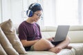 Preteen boy uses a laptop for playing online games Royalty Free Stock Photo