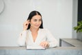 Picture of pretty receptionist at work. Royalty Free Stock Photo