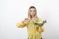 Picture of a pretty woman model with cauliflower showing a thumb down