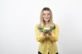 Picture of a pretty woman model standing and looking at cauliflower