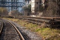 Selective blur on a railroad track in curve with new rails with concrete sleepers ready for replacing the old railway line