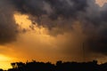 A picture of a rain cloud with a lot of noise, a photograph of a falling rainstorm, a large storm cloud over a shadowy forest.