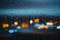 Picture Raindrops on glass window against blurred city lights background Royalty Free Stock Photo