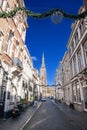 MAASTRICHT, NETHERLANDS - NOVEMBER 10, 2022: Rechstraat street, a pedestrian street of the city center of Maastricht with the Sint