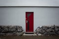 a red door leading to a red brick wall Royalty Free Stock Photo