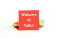 Picture of a red note paper with text welcome to