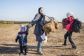 Refugee woman surrounded by children walking to the Croatia Serbia border, between the cities of Bapska and Berkasovo