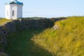 The picture remnants of the defensive moat of the fortress on the background of Constantine and Helen chapel. Solovki. Russia