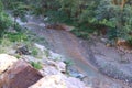 A picture of a river below the valley