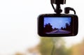 Picture road and tree on camera in car