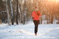 Picture of running sports girl on winter forest in morning Royalty Free Stock Photo