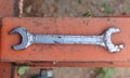A picture of a rusted wrench.