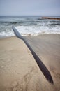 Rusty pipeline on a beach Royalty Free Stock Photo