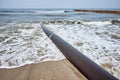 Rusty pipeline on a beach Royalty Free Stock Photo