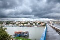 BELGRADE, SERBIA - AUGUST 6, 2023: View of Sava river bank and a splav club in Belgrade with Brankov Most bridge on the right and Royalty Free Stock Photo