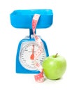 Picture of scale with apple and measure tape Royalty Free Stock Photo