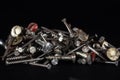 Selective blur on a pile of nails and screws, old, some rusty, of silver and white colors used in construction and carpentry, for Royalty Free Stock Photo