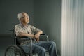 Senior man thinking something in a wheelchair Royalty Free Stock Photo