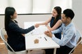 Asian female salesman sit in a modern office room and talk to customers and be satisfied with success. Royalty Free Stock Photo