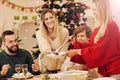 Group of family and friends celebrating Christmas dinner Royalty Free Stock Photo