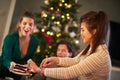 Group of friends celebrating Christmas at home Royalty Free Stock Photo