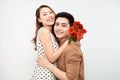 Picture showing happy couple hugging with flowers