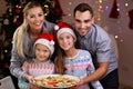 Happy family preparing Christmas biscuits Royalty Free Stock Photo