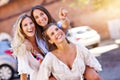 Happy girl friends hanging out in the city in summer Royalty Free Stock Photo