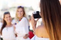 Happy girl friends hanging out in the city in summer Royalty Free Stock Photo