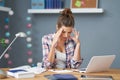 Tired female student learning till late at home Royalty Free Stock Photo