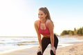 Woman running alone at beautiful dusk on the beach