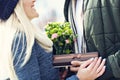 Picture showing young couple with flowers dating in the city Royalty Free Stock Photo