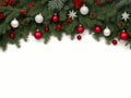 Christmas border isolated on a white background, composed of fresh fir branches and ornaments in red and silver color. Royalty Free Stock Photo