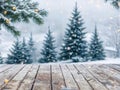 Empty wooden table in front of snow forest. Merry Christmas and Happy New Year background for product display. Royalty Free Stock Photo