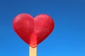 Heart shaped ice in front of the sky Royalty Free Stock Photo