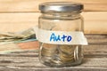 Euro money, mason jar and savings for car