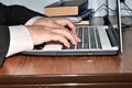 A man works on a laptop keyboard. Royalty Free Stock Photo