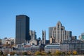 Skyline of the Old Montreal, with the Notre Dame Basilica in front, and stone and glass Skyscrapers in the background. Royalty Free Stock Photo